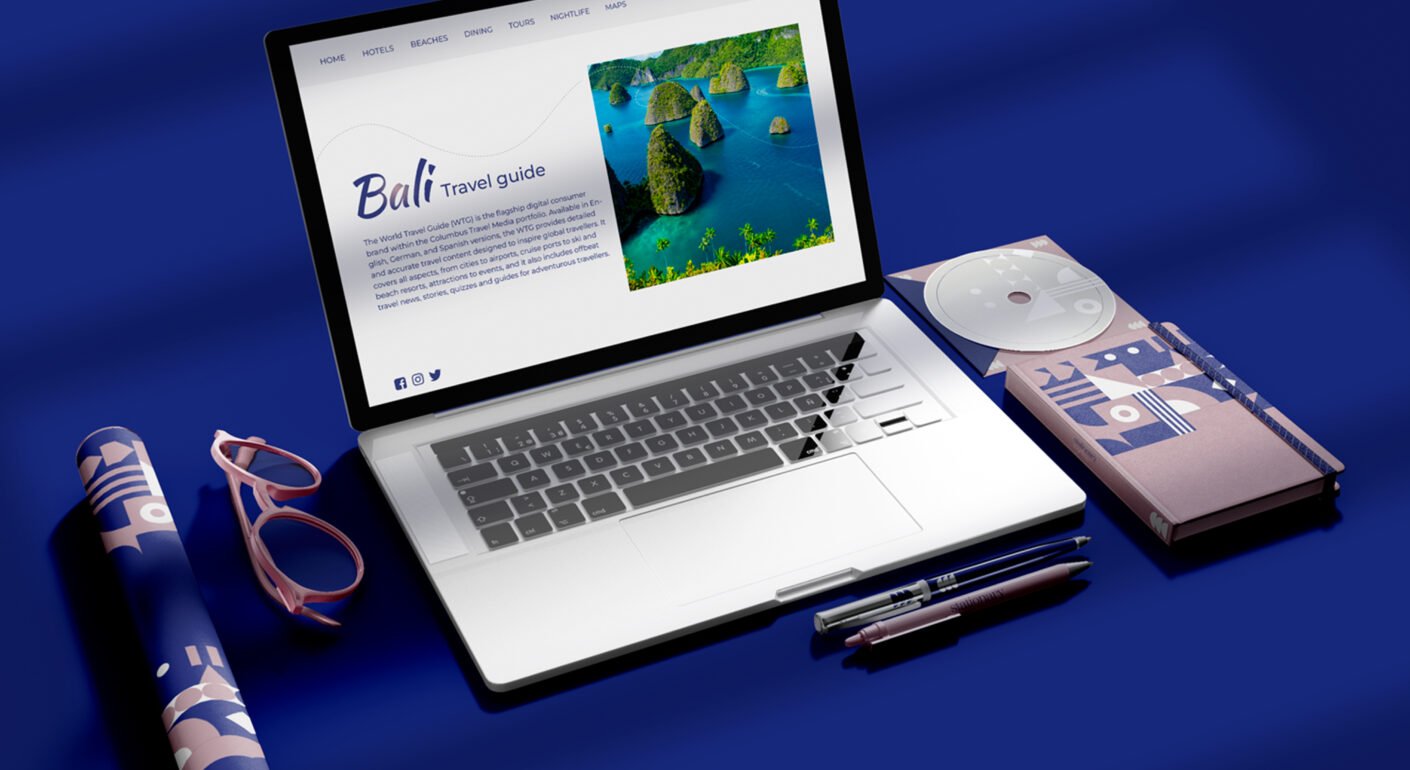 Travel branding mockup featuring a Bali travel guide website on a laptop with promotional materials and stationery accessories.