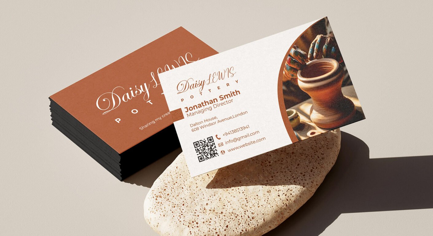Elegant pottery studio business card mockup with ceramic artwork, QR code, and professional contact information.