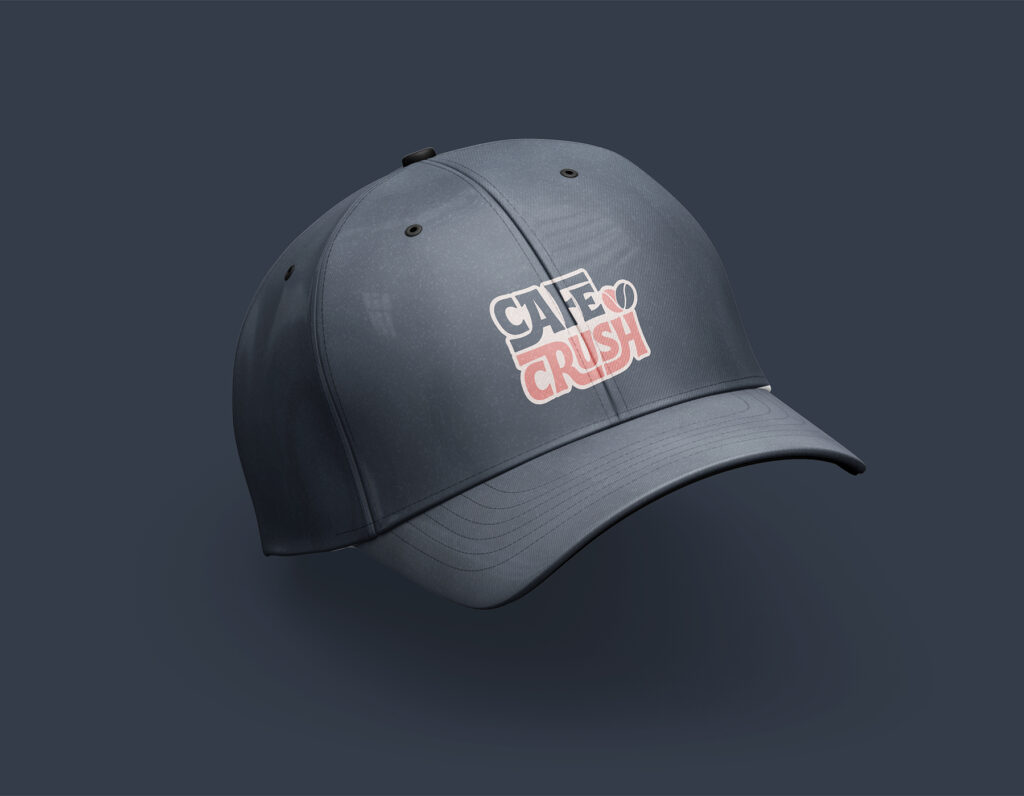 Dark gray baseball cap mockup featuring the Cafe Crush logo embroidered on the front panel.