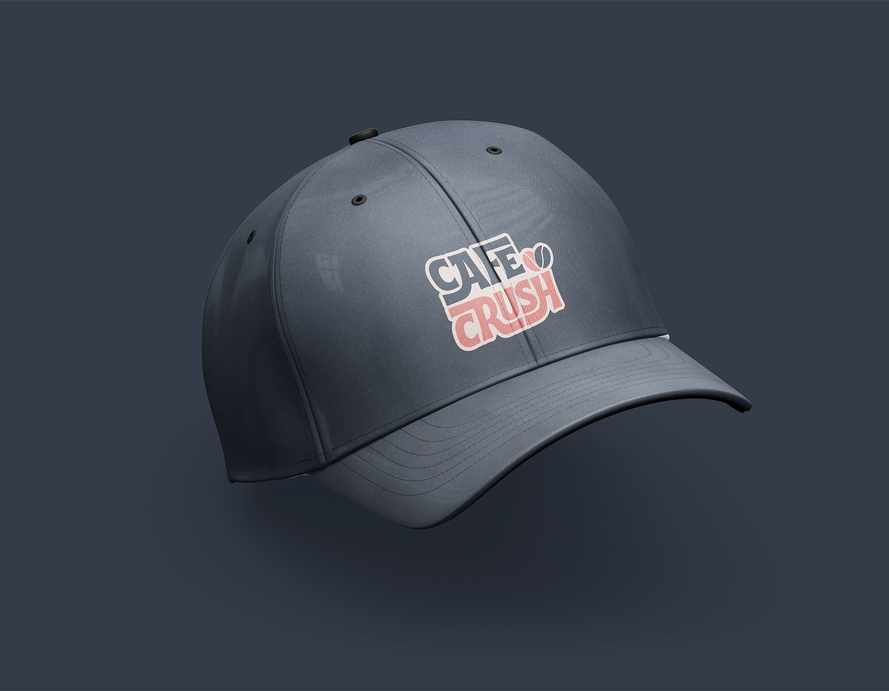 Dark gray baseball cap mockup featuring the Cafe Crush logo embroidered on the front panel.