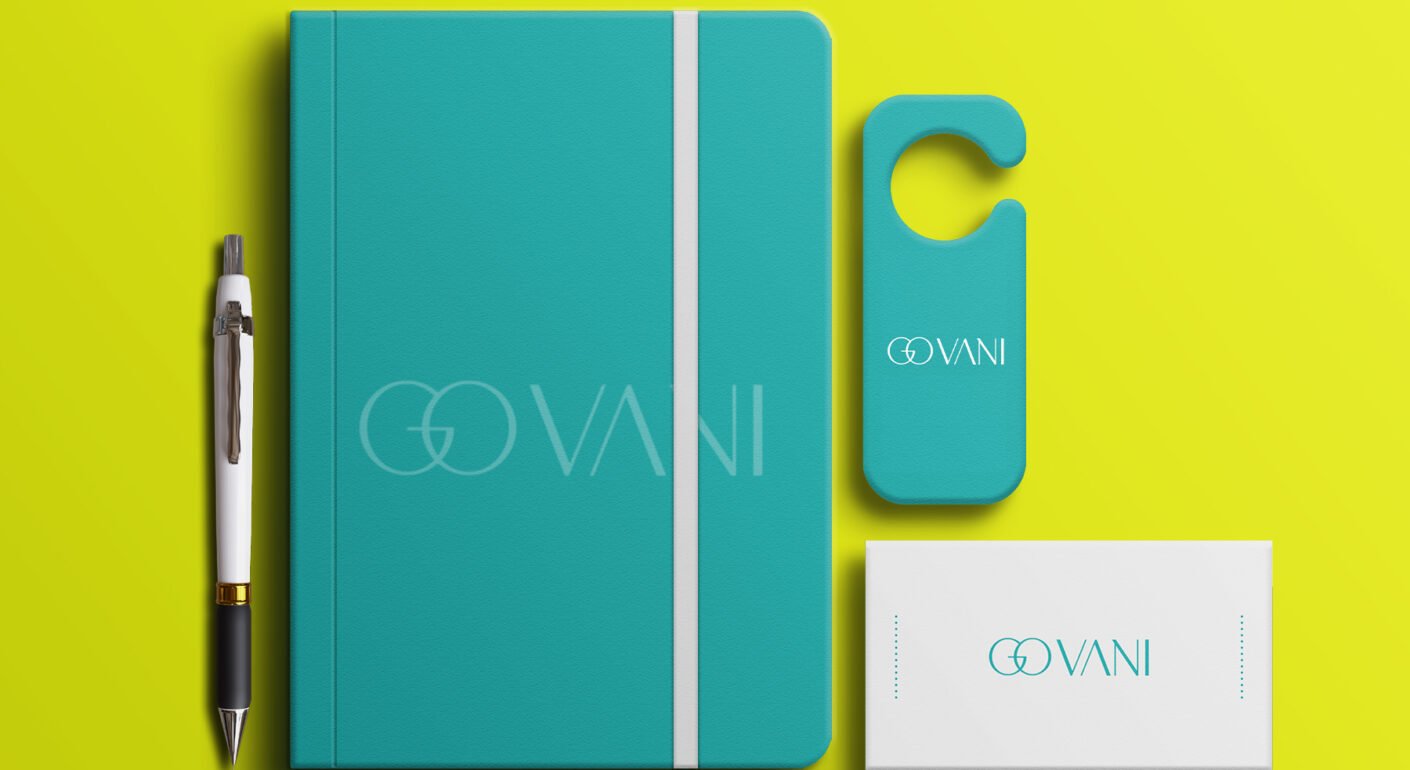 Turquoise branded notebook, business card, pen, and door hanger mockup on a bright yellow background.