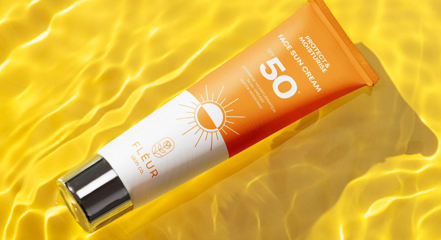 SPF 50 sunscreen cream packaging mockup with vibrant summer skincare branding and sun protection design.